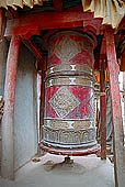 Ladakh - Shey palace, large prayel wheel at the entrance of the gompa